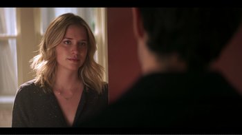 Movie still from “You” (2018), created by Sera Gamble – A woman standing in front of a mirror looking at a man; Close Up shot, Over the shoulder angle
