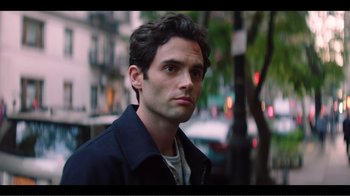 Movie still from “You” (2018), created by Sera Gamble – A person wearing a jacket; Close Up shot, Over the shoulder angle