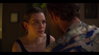 Movie still from “You” (2018), created by Sera Gamble – A woman looking at a man in front of a mirror; Close Up shot, Over the shoulder angle
