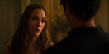 Movie still from “You” (2018), created by Sera Gamble – A woman looking at a man in the mirror; Close Up shot, Over the shoulder angle