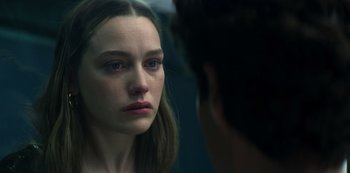 Movie still from “You” (2018), created by Sera Gamble – A woman looking at a man in the mirror; Close Up shot, Over the shoulder angle
