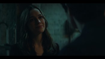 Movie still from “You” (2018), created by Sera Gamble – A woman is looking at a man in a dark room; Close Up shot, Over the shoulder angle