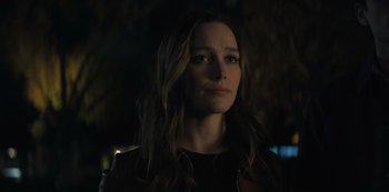 Movie still from “You” (2018), created by Sera Gamble – A person with long brown hair; Close Up shot, Over the shoulder angle