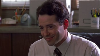 Movie still from “You Can Count on Me” (2000), directed by Kenneth Lonergan – A man in a white dress shirt and a tie smiling; Close Up shot, Low angle