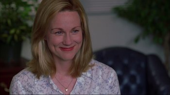 Movie still from “You Can Count on Me” (2000), directed by Kenneth Lonergan – A person smiling at the camera; Close Up shot, Over the shoulder angle