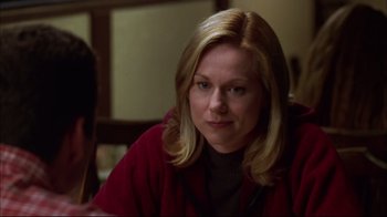 Movie still from “You Can Count on Me” (2000), directed by Kenneth Lonergan – A woman sitting at a table looking at the camera; Close Up shot, Over the shoulder angle