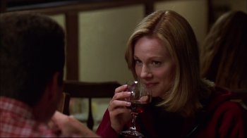 Movie still from “You Can Count on Me” (2000), directed by Kenneth Lonergan – A woman holding a glass of red wine in her hand; Close Up shot, Over the shoulder angle