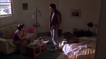 Movie still from “You Can Count on Me” (2000), directed by Kenneth Lonergan – A man standing in a room next to a woman; Wide shot, Low angle
