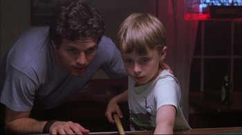 Movie still from “You Can Count on Me” (2000), directed by Kenneth Lonergan – A man and a boy are playing a game of pool; Close Up shot, Over the shoulder angle