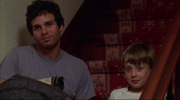 Movie still from “You Can Count on Me” (2000), directed by Kenneth Lonergan – A man and a boy sitting next to each other on the stairs; Medium shot, Over the shoulder angle