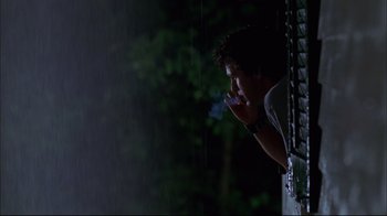 Movie still from “You Can Count on Me” (2000), directed by Kenneth Lonergan – A man looking out of a window at night; Medium shot, Low angle