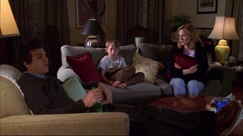 Movie still from “You Can Count on Me” (2000), directed by Kenneth Lonergan – A boy sitting on a couch in a living room; Wide shot, High angle