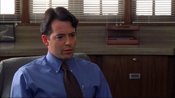 Movie still from “You Can Count on Me” (2000), directed by Kenneth Lonergan – A man wearing a blue shirt and a brown tie; Close Up shot, Over the shoulder angle