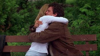 Movie still from “You Can Count on Me” (2000), directed by Kenneth Lonergan – A man and a woman hugging on a park bench; Medium shot, Low angle
