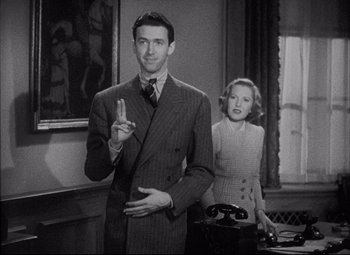 Movie still from “You Can't Take It with You” (1938), directed by Frank Capra – A man and a woman standing next to each other in a room; Medium shot, Low angle