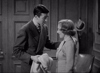 Movie still from “You Can't Take It with You” (1938), directed by Frank Capra – A man and a woman are holding a towel; Medium shot, High angle