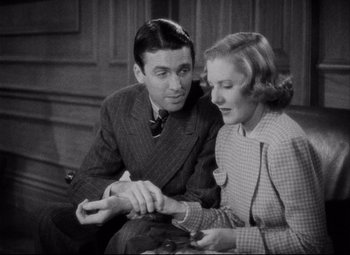 Movie still from “You Can't Take It with You” (1938), directed by Frank Capra – A man and a woman sitting next to each other; Medium shot, Overhead angle