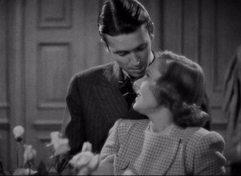 Movie still from “You Can't Take It with You” (1938), directed by Frank Capra – A man and a woman standing next to each other; Close Up shot, High angle