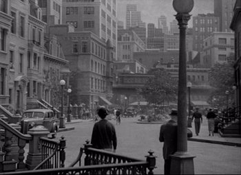 Movie still from “You Can't Take It with You” (1938), directed by Frank Capra – A black - and - white photo of a city street; Extreme Wide shot, High angle