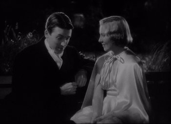 Movie still from “You Can't Take It with You” (1938), directed by Frank Capra – A man and a woman are talking to each other; Medium shot, High angle