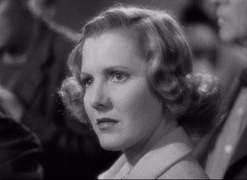 Movie still from “You Can't Take It with You” (1938), directed by Frank Capra – An old photo of an older woman in a white dress; Close Up shot, Low angle