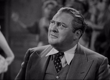 Movie still from “You Can't Take It with You” (1938), directed by Frank Capra – An older man wearing a suit and tie; Close Up shot, Low angle