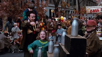 Movie still from “You've Got Mail” (1998), directed by Nora Ephron – A group of people on the street playing a game of milk jugs; Medium shot, High angle