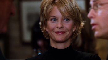 Movie still from “You've Got Mail” (1998), directed by Nora Ephron – A person with blonde hair; Close Up shot, Over the shoulder angle