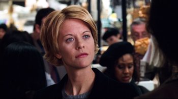 Movie still from “You've Got Mail” (1998), directed by Nora Ephron – A person with short blonde hair; Close Up shot, Over the shoulder angle