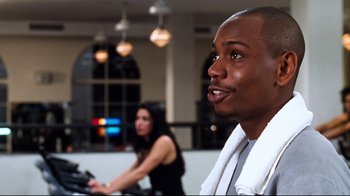 Movie still from “You've Got Mail” (1998), directed by Nora Ephron – A man and a woman are in a gym; Close Up shot, Over the shoulder angle