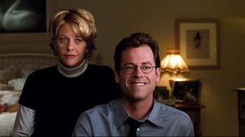 Movie still from “You've Got Mail” (1998), directed by Nora Ephron – A man and a woman posing for a picture; Close Up shot, Low angle