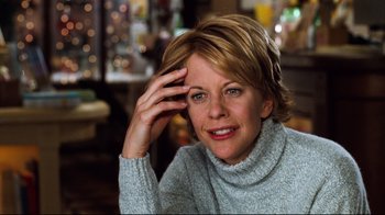 Movie still from “You've Got Mail” (1998), directed by Nora Ephron – A person wearing a sweater; Close Up shot, Over the shoulder angle
