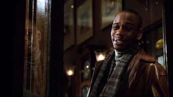 Movie still from “You've Got Mail” (1998), directed by Nora Ephron – A man standing in front of a window; Close Up shot, Over the shoulder angle