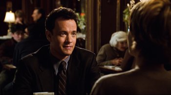 Movie still from “You've Got Mail” (1998), directed by Nora Ephron – A man sitting at a table in front of a woman; Close Up shot, Over the shoulder angle