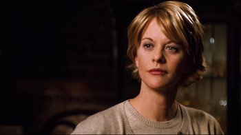Movie still from “You've Got Mail” (1998), directed by Nora Ephron – A person with short blonde hair; Close Up shot, Over the shoulder angle
