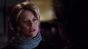 Movie still from “You've Got Mail” (1998), directed by Nora Ephron – A person with short blonde hair; Close Up shot, Over the shoulder angle