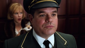 Movie still from “You've Got Mail” (1998), directed by Nora Ephron – A person wearing a uniform; Close Up shot, Low angle