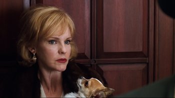 Movie still from “You've Got Mail” (1998), directed by Nora Ephron – A woman holding a dog in her arms; Close Up shot, Over the shoulder angle
