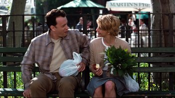 Movie still from “You've Got Mail” (1998), directed by Nora Ephron – A man and a woman sitting on a park bench; Medium shot, Over the shoulder angle