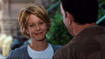 Movie still from “You've Got Mail” (1998), directed by Nora Ephron – A man and a woman talking to each other; Close Up shot, Over the shoulder angle