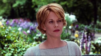 Movie still from “You've Got Mail” (1998), directed by Nora Ephron – A person with short blonde hair; Close Up shot, Over the shoulder angle