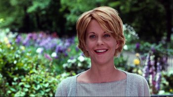 Movie still from “You've Got Mail” (1998), directed by Nora Ephron – A person with short blonde hair; Close Up shot, Over the shoulder angle