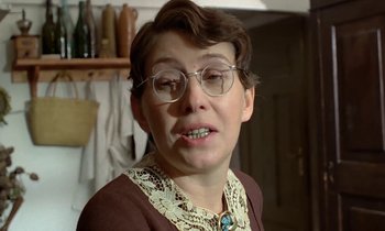 Movie still from “The Maids of Wilko” (1979), directed by Andrzej Wajda – An older woman wearing glasses and a brown sweater; Close Up shot, Low angle