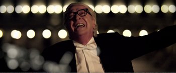 Movie still from “Youth” (2015), directed by Paolo Sorrentino – An older man wearing a tuxedo and bow tie; Close Up shot, Low angle