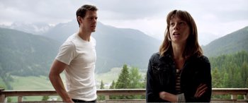 Movie still from “Youth” (2015), directed by Paolo Sorrentino – A man and a woman standing next to each other on a deck; Medium shot, Over the shoulder angle