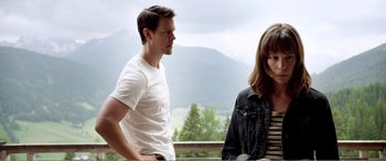 Movie still from “Youth” (2015), directed by Paolo Sorrentino – A man and a woman standing next to each other on a deck; Medium shot, Over the shoulder angle