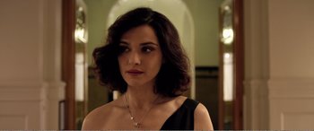 Movie still from “Youth” (2015), directed by Paolo Sorrentino – A beautiful woman with dark curly hair wearing a black dress; Close Up shot, Over the shoulder angle