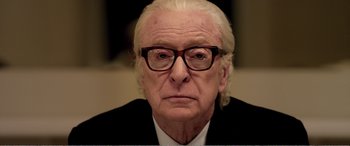 Movie still from “Youth” (2015), directed by Paolo Sorrentino – An older man wearing glasses and a suit; Close Up shot, Low angle