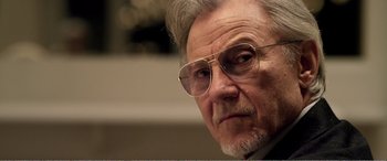 Movie still from “Youth” (2015), directed by Paolo Sorrentino – An older man wearing glasses looking at the camera; Close Up shot, Low angle