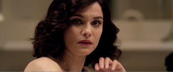 Movie still from “Youth” (2015), directed by Paolo Sorrentino – A person wearing a necklace; Close Up shot, High angle